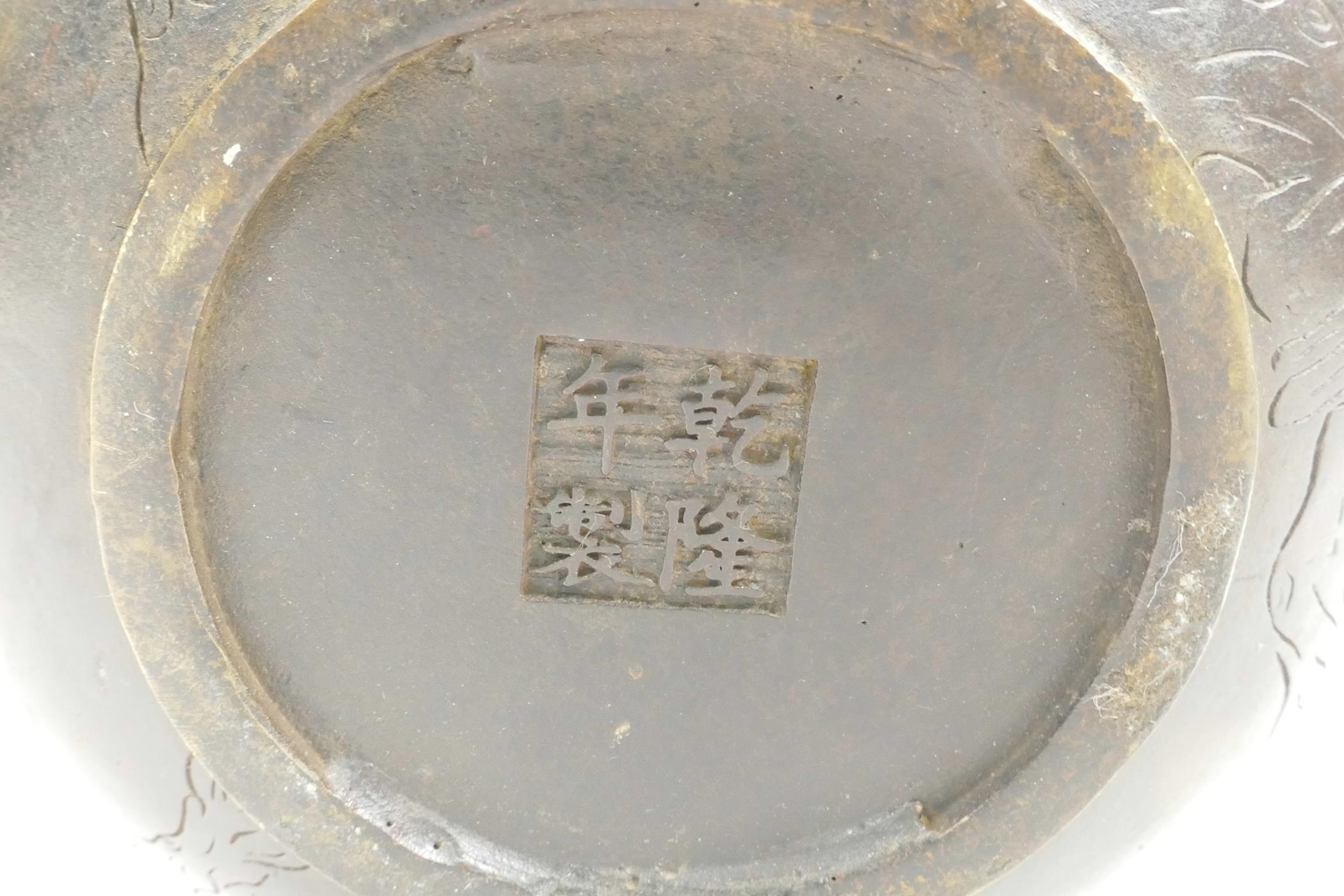 A Chinese bronze teapot with raised decoration of cranes in flight, four character mark to base, 5½" - Image 6 of 6