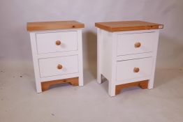 A pair of painted pine two drawer bedside chests, 14" x 20" x 25"