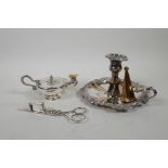 A silver plated chamberstick and snuffer with repousse swag decoration, together with a silver