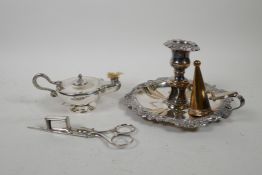 A silver plated chamberstick and snuffer with repousse swag decoration, together with a silver