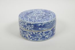 A Chinese blue and white porcelain box and cover with phoenix decoration, six character mark to