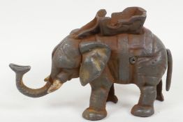 A cast iron elephant money box, 5" high