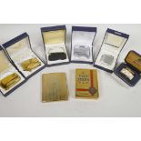 Seven boxed cigarette lighters including three Ronson Varaflame (one new), together with a gilt