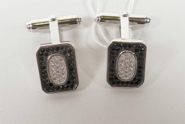 A pair of 925 silver cufflinks encrusted with cubic zirconium and marcasite