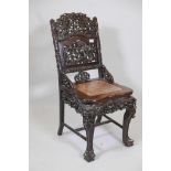 A C19th Chinese carved and pierced hardwood chest with inset hardstone seat, the sides decorated