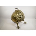 A Victorian brass barrel shaped coal scuttle on paw feet, with pierced decoration, 15" long x 17"