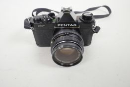 A Pentax MV single lens reflex 35mm camera, together with a Pentax M 1:250 mm lens