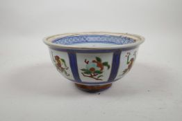 A Chinese Imari style porcelain bowl decorated with gourds and fruit, six character mark to base, 7"