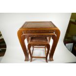 Three oriental carved wood nesting tables on swept supports, largest 24" high x 21" wide x 14" deep