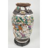 A C19th Chinese porcelain crackleware vase decorated with warriors in bright enamels and raised