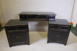 A Chinese style black lacquer bedroom suite comprising two bedside cabinets and a two drawer side