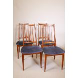 A set of four Danish mid century teak chairs with slat backs