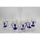 Five custard glasses with clear bowls and blue stems, and handles, together with six engraved
