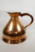 A one gallon Edwardian harvest copper flagon of pear shaped form, made with heavy gauge copper, well