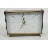 A vintage Schatz brass cased mantel clock with gilt hands and a striking movement, 8" long