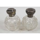 Two cut glass dressing table perfume bottles with hallmarked silver tops, hallmarked Birmingham 1885