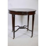 An early C20th mahogany centre table with a crossbanded top and Adam style decoration raised on