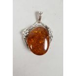 An Art Nouveau style 925 silver and faux Baltic amber set pendant, 2" drop