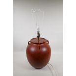 A mid C20th Heal's ceramic lamp with a red speckle glaze, base 12½" high