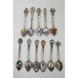 A superb collection of C19th sterling silver and 800 silver souvenir enamel spoons with figural