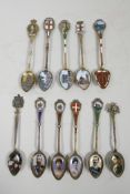 A superb collection of C19th sterling silver and 800 silver souvenir enamel spoons with figural