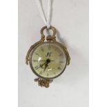A small brass bound ball pocket clock, 3" long