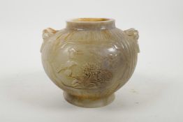 A Chinese alabaster jar with two mask handles and carved bamboo and floral decoration, 5" high