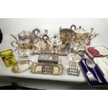 A quantity of silver plated wares including tea and coffee pots, boxed salad servers and