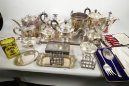 A quantity of silver plated wares including tea and coffee pots, boxed salad servers and