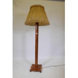 An Art Deco standard lamp with moulded column and stepped shaped base, 55" high