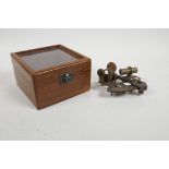 A cased reproduction brass sextant, 5" x 5"