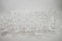 A suite of cut glass wine and cordial glasses together with a pair of red wine glass and three