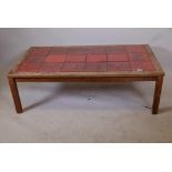 A 1970s rosewood and tile top Danish coffee table, one tile A/F, 52½" x 29", 16½" high