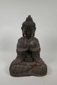A Chinese bronzed metal figure of Buddha seated in meditation with distressed gilt patina, 16" high