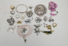 A quantity of silver and other costume jewellery including rings, necklaces, brooches etc