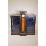 A C19th French breakfront pier cabinet, with brass inlaid ebonised doors and gilt brass classical