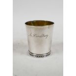 A C19th Swedish hand tooled silver beaker by Johan Niklas Palm, 2½" high, 48 grams