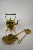 An antique brass spirit kettle with an ebony handle, together with a brass ladle and chestnut