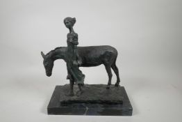 A bronze figure of a girl with an ass, 12" x 6½", 13" high