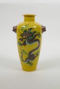 A Chinese Sancai glazed porcelain vase with two kylin mask handles, and dragon decoration, six