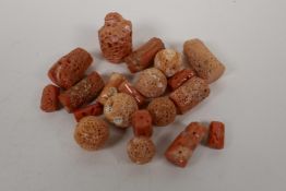 A quantity of loose coral beads of assorted shapes and sizes