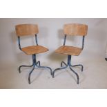 A pair of tubular steel and bent ply industrial chairs, 33" high