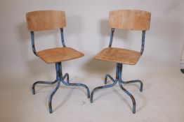 A pair of tubular steel and bent ply industrial chairs, 33" high