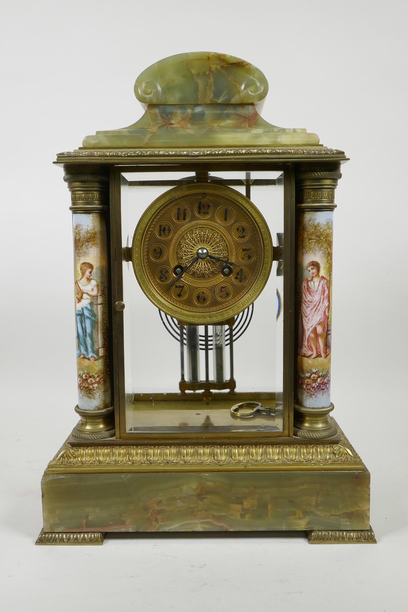 A French onyx and brass cased portico clock with enamelled columns decorated with classical maidens,