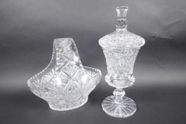 A cut lead crystal pedestal sweet jar and cover, 12½" high, together with a cut crystal basket fruit