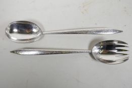 A rare pair of early C19th silver salad servers, with chased foliate decoration, by Chawner & Co (