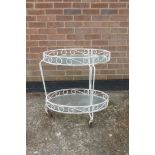 A painted wrought metal two tier conservatory table, 17½" x 25", 26" high