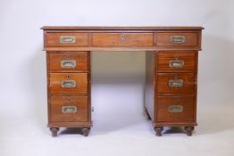 A C19th mahogany campaign pedestal desk, with long chart drawer over six drawers, fitted with