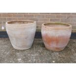 A near pair of terracotta pots, 17" high x 20" diameter