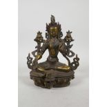 A Sino Tibetan gilt bronze female deity inset with semi precious stones, 8" high